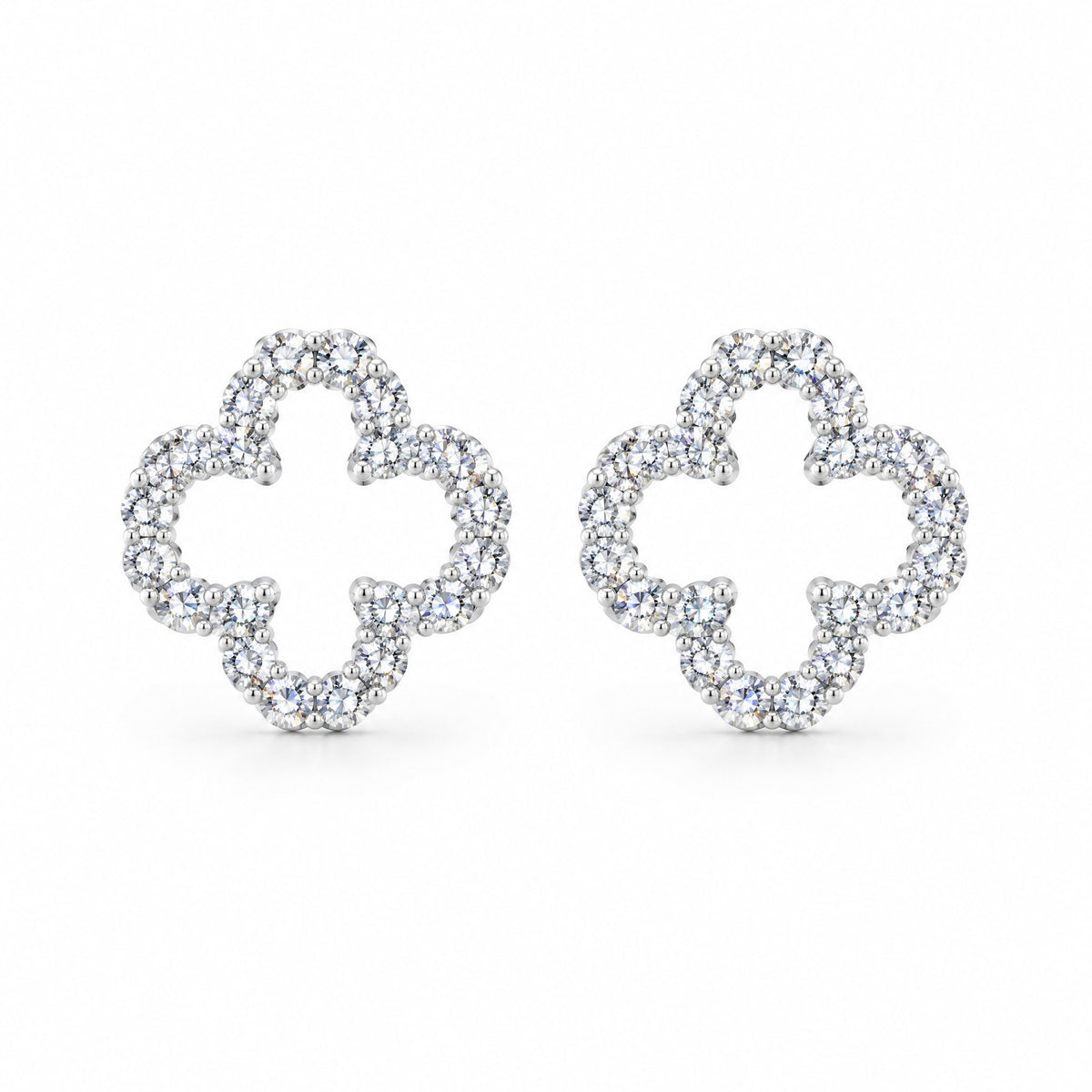 Pair of open clover outline earrings set with moissanite