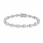 Pear-cut moissanite tennis bracelet laid flat with its box clasp