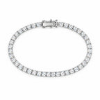 4mm moissanite tennis bracelet laid flat in an oval, clasp at the top