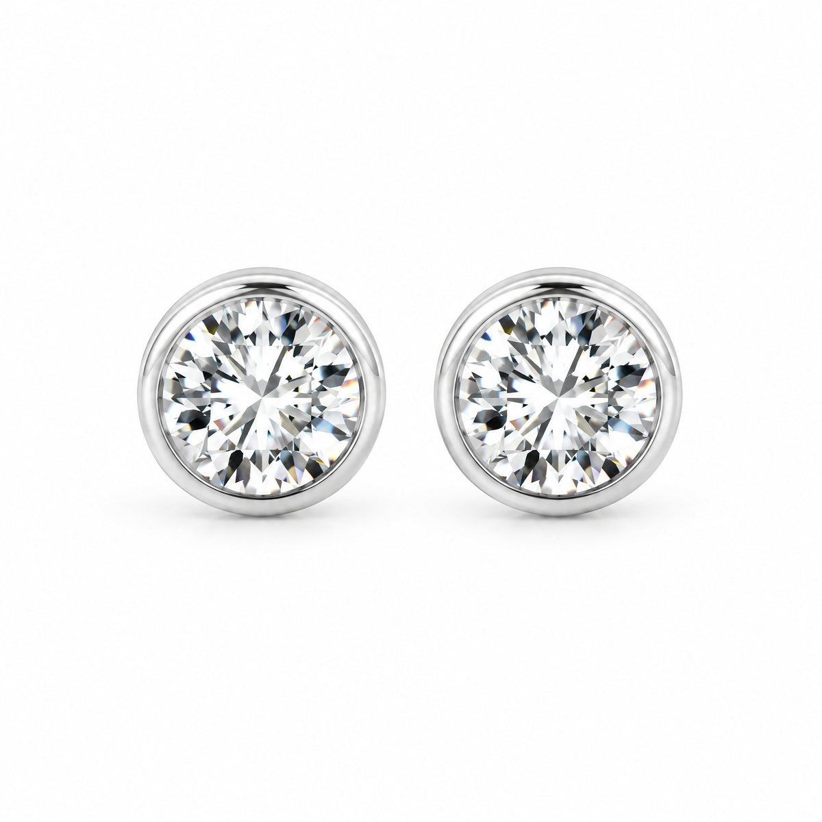 Pair of round moissanite solitaire studs, front view