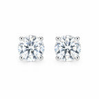 Pair of round moissanite stud earrings in four-prong settings