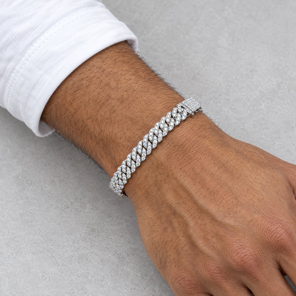 Man wearing an 8mm Cuban link bracelet below a white shirt cuff
