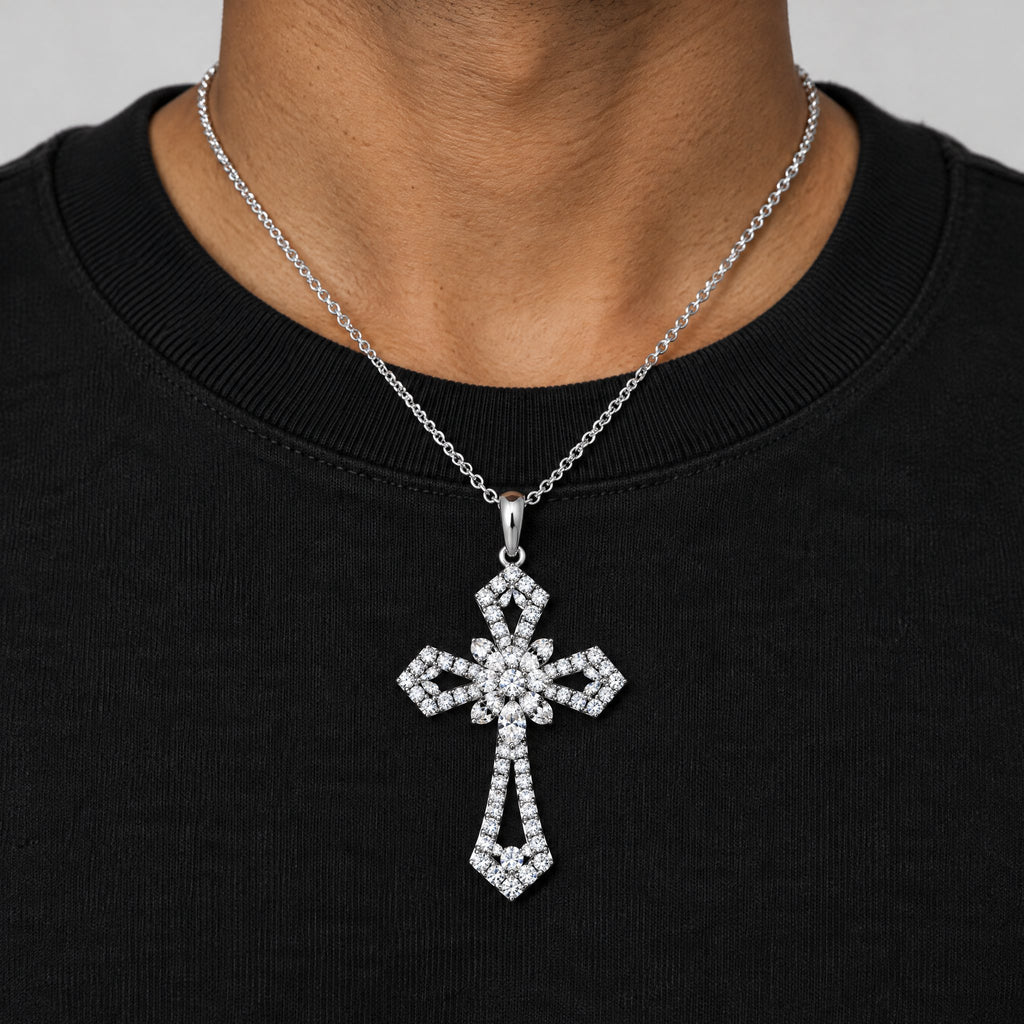 Man in a black T-shirt wearing the statement cross pendant