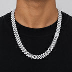 Man in a black T-shirt wearing a 10mm iced Cuban link chain