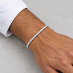Man wearing a 3mm tennis bracelet below a white shirt cuff