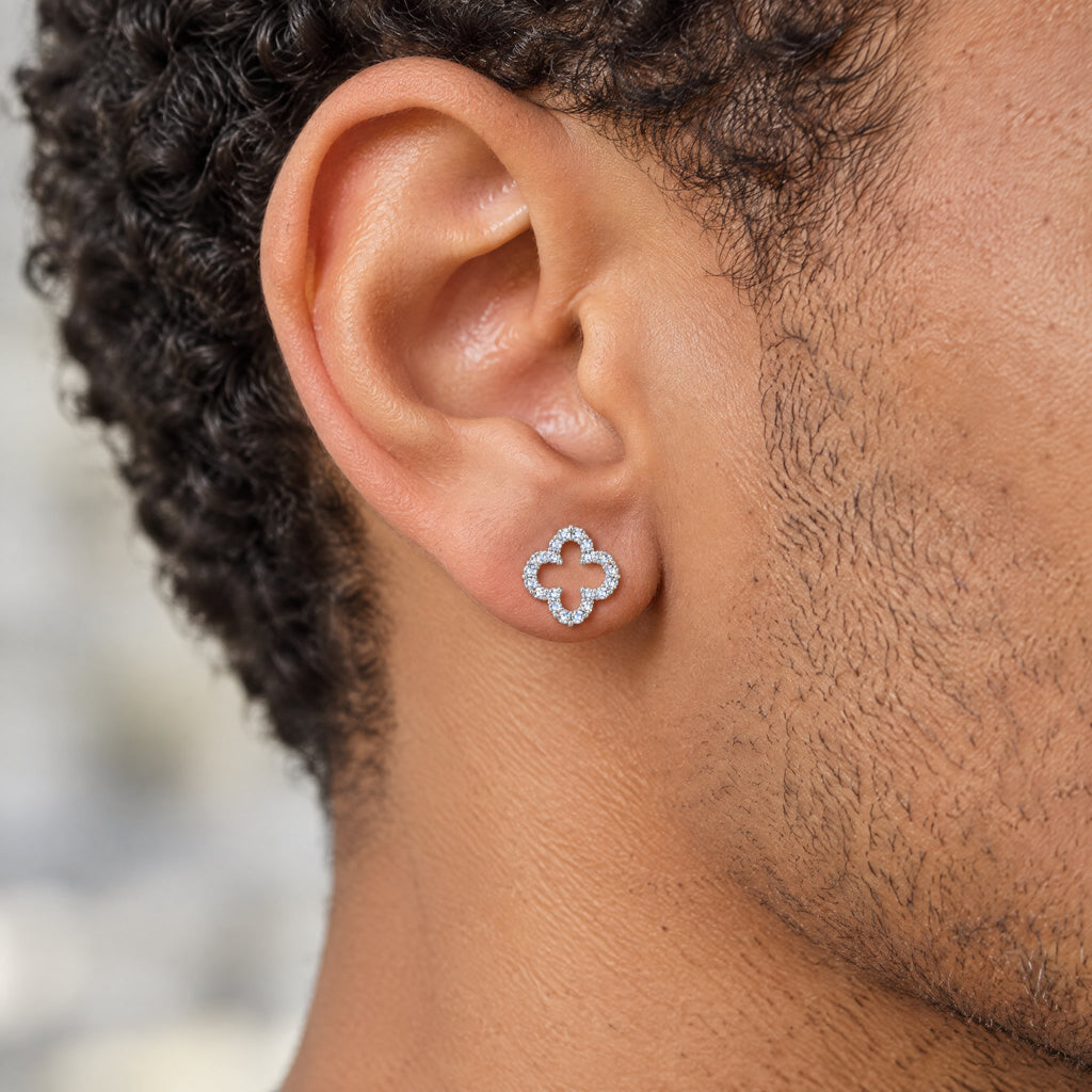 Clover outline earring worn on the earlobe