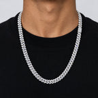 Man in a black T-shirt wearing an 8mm iced Cuban link chain