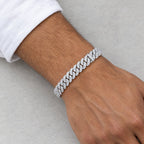 Man wearing a 10mm iced Cuban link bracelet below a white shirt cuff