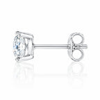 Side view of a round four-prong stud earring with its butterfly back