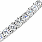 Close-up of round four-prong moissanite stones on the 4mm tennis chain