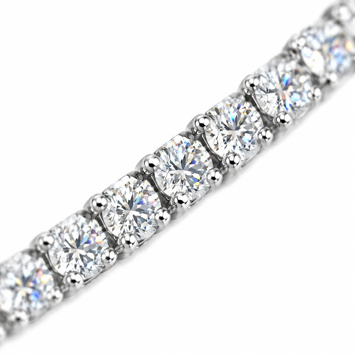 Close-up of round four-prong moissanite stones on the 3mm tennis chain