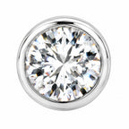 Close-up of a round moissanite stone in a polished bezel
