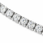 Close-up of four-prong round moissanite stones on the 3mm tennis bracelet