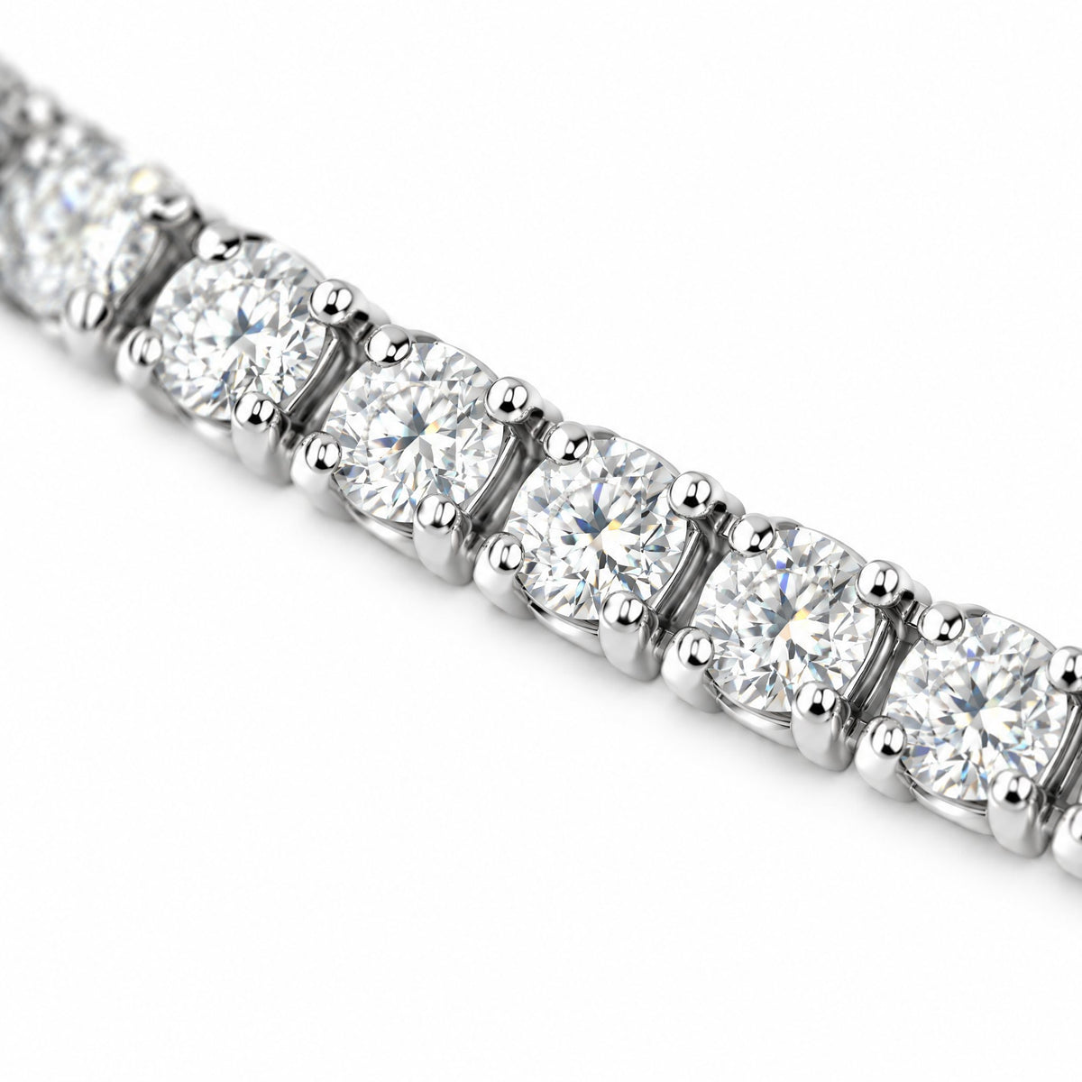 Close-up of four-prong round moissanite stones on the 3mm tennis bracelet