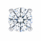Close-up of a round moissanite stone held by four prongs