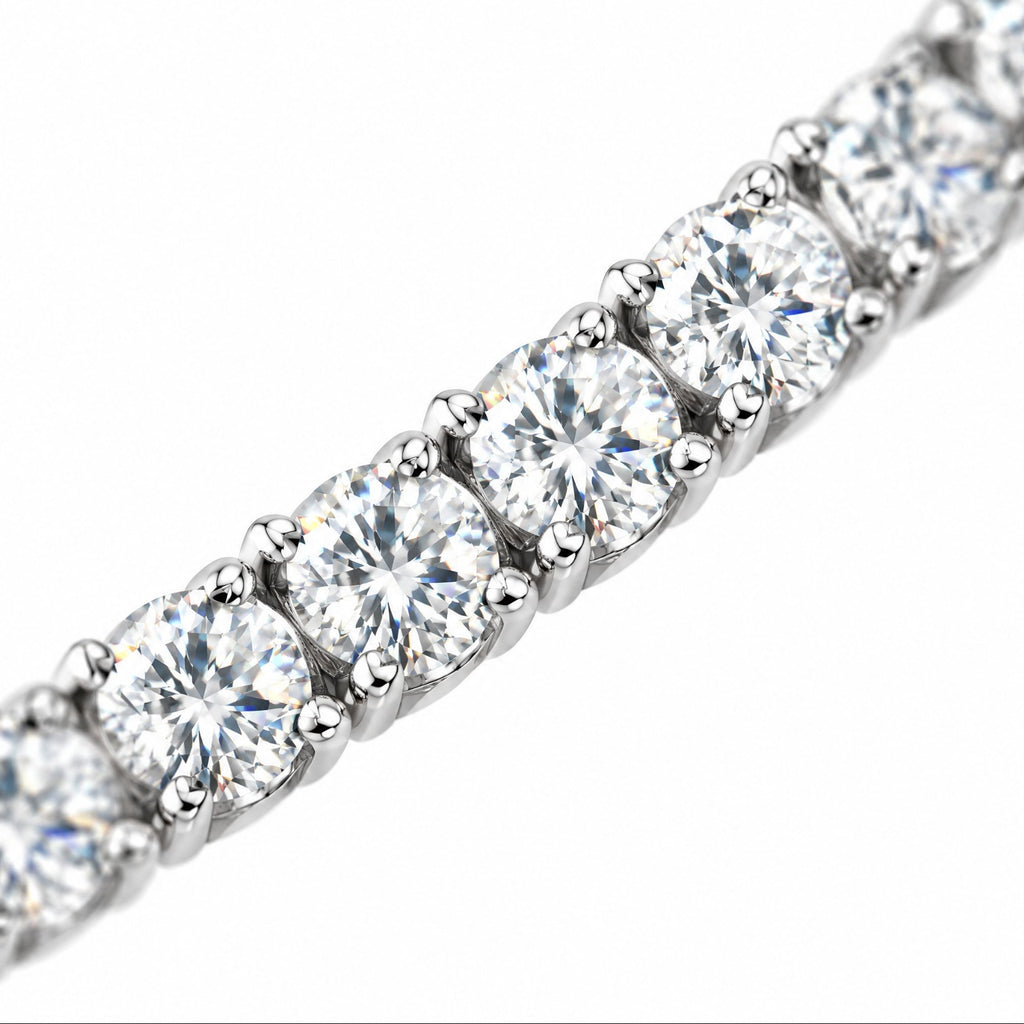 Close-up of round four-prong moissanite stones on the 5mm tennis chain
