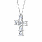Slim cross pendant hanging from its chain