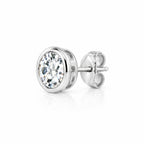 Round moissanite solitaire stud earring in a bezel setting, side angle