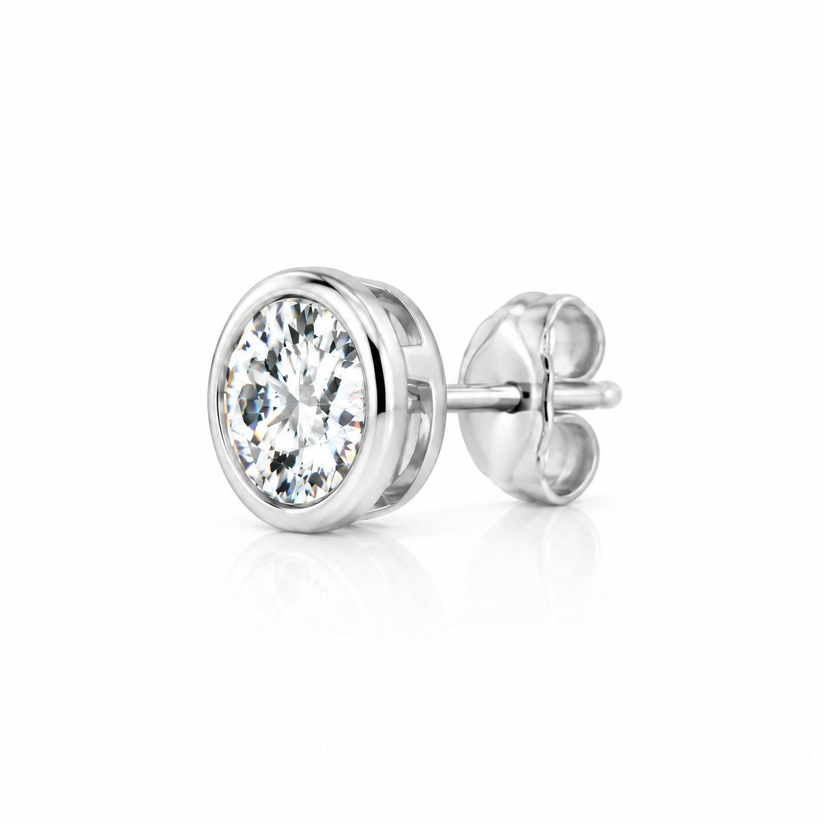 Round moissanite solitaire stud earring in a bezel setting, side angle