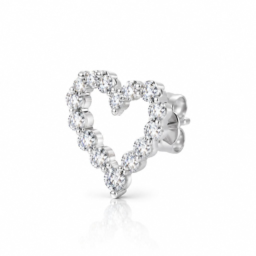 Single heart outline earring at an angle