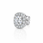 Single halo stud earring at an angle