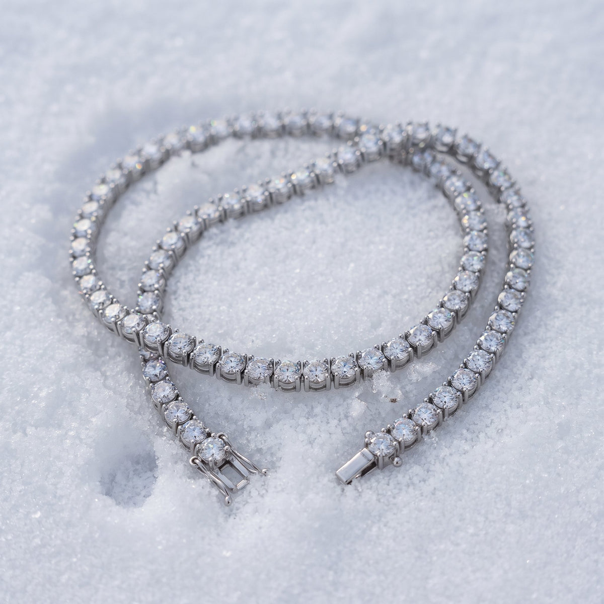 4mm tennis chain draped across snow