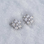 Pair of cluster stud earrings on snow