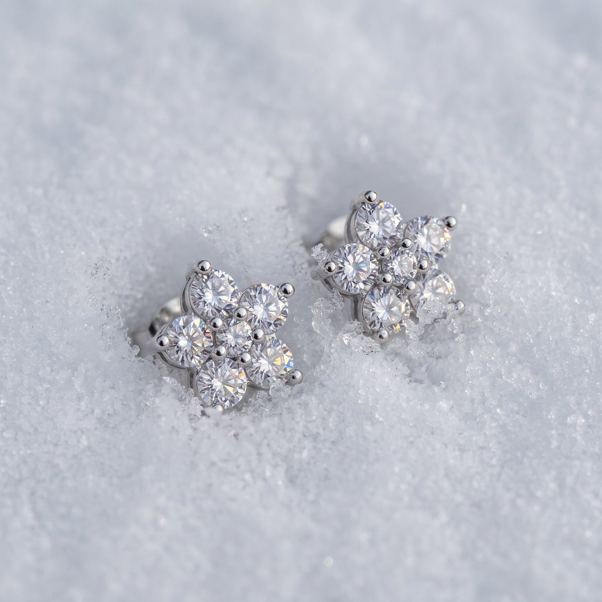 Pair of cluster stud earrings on snow