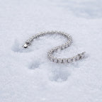 3mm tennis bracelet lying on snow