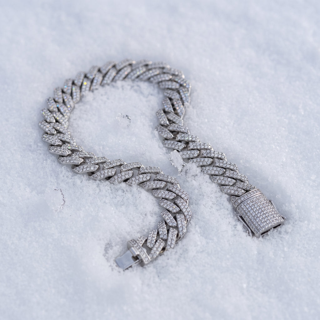 8mm Cuban link bracelet curved across fresh snow