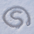 8mm Cuban link chain coiled on snow