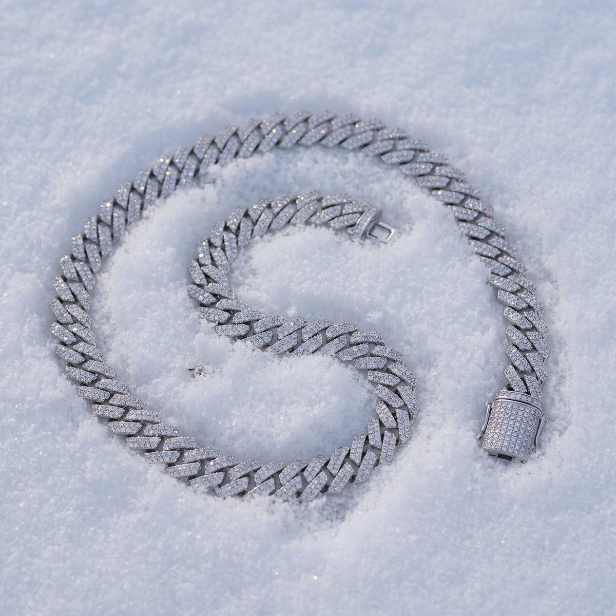 8mm Cuban link chain coiled on snow