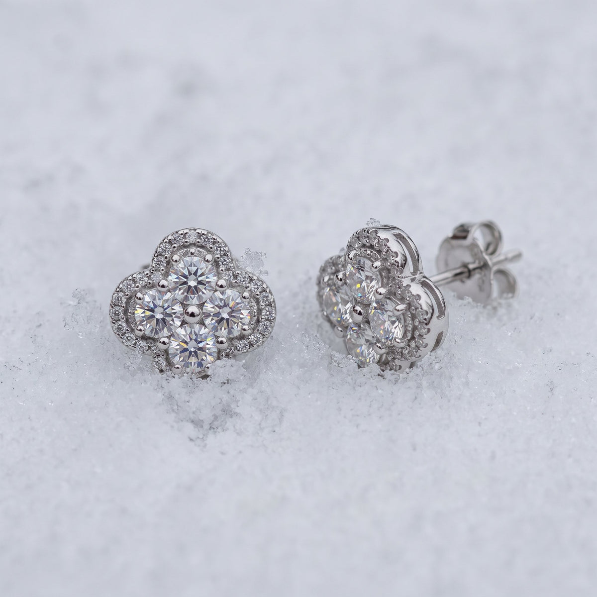 Pair of clover cluster studs on snow