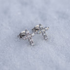 Pair of cross studs on snow