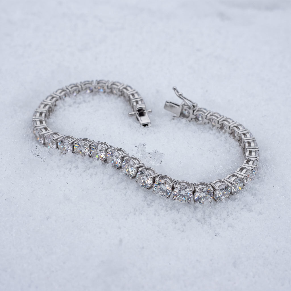 5mm tennis bracelet lying open on snow
