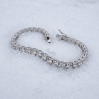 5mm tennis bracelet lying open on snow